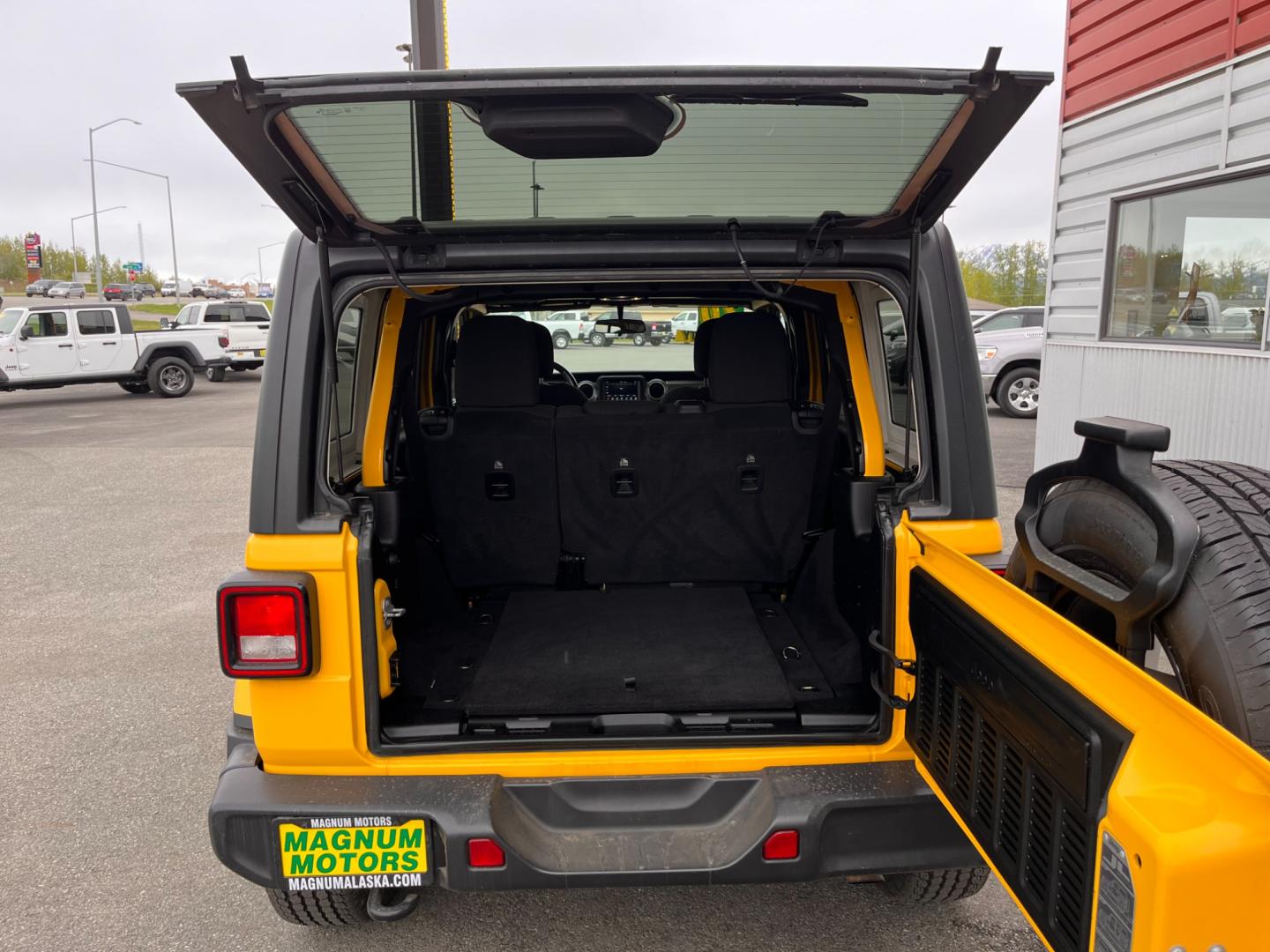 2020 YELLOW JEEP WRANGLER UNLIMI SAHARA (1C4HJXEN2LW) with an 2.0L engine, Automatic transmission, located at 1960 Industrial Drive, Wasilla, 99654, (907) 274-2277, 61.573475, -149.400146 - Photo#14