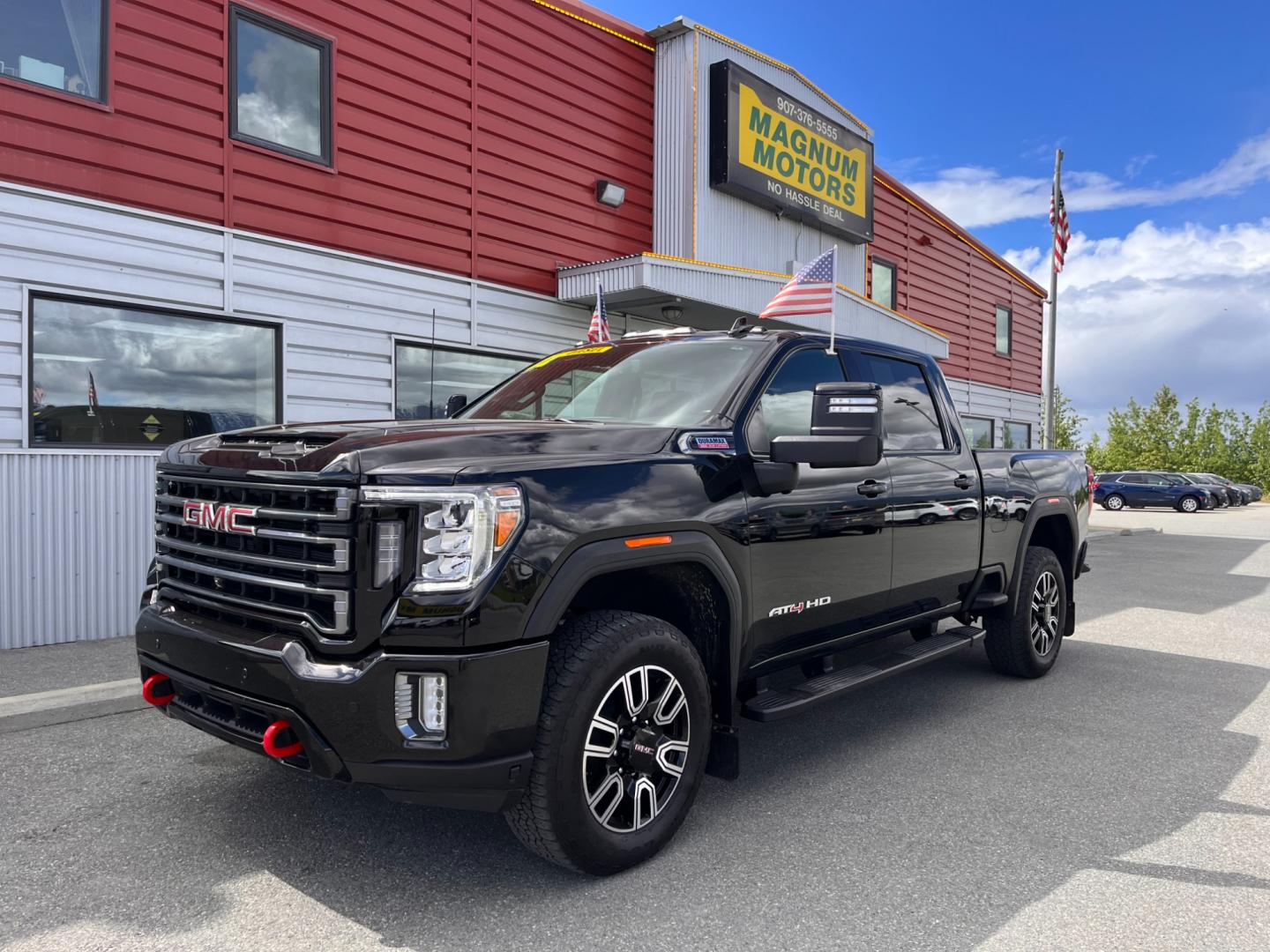 2022 Black GMC Sierra 3500HD AT4 Crew Cab Long Box 4WD (1GT49VEY3NF) with an 6.6L V8 OHV 16 DIESEL engine, 6A transmission, located at 1960 Industrial Drive, Wasilla, 99654, (907) 274-2277, 61.573475, -149.400146 - Photo#0