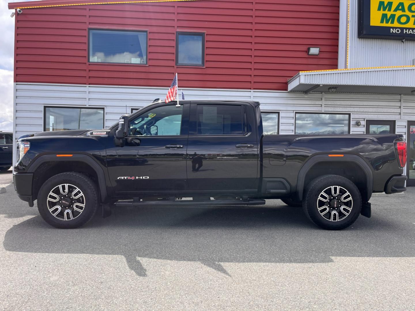 2022 Black GMC Sierra 3500HD AT4 Crew Cab Long Box 4WD (1GT49VEY3NF) with an 6.6L V8 OHV 16 DIESEL engine, 6A transmission, located at 1960 Industrial Drive, Wasilla, 99654, (907) 274-2277, 61.573475, -149.400146 - Photo#1