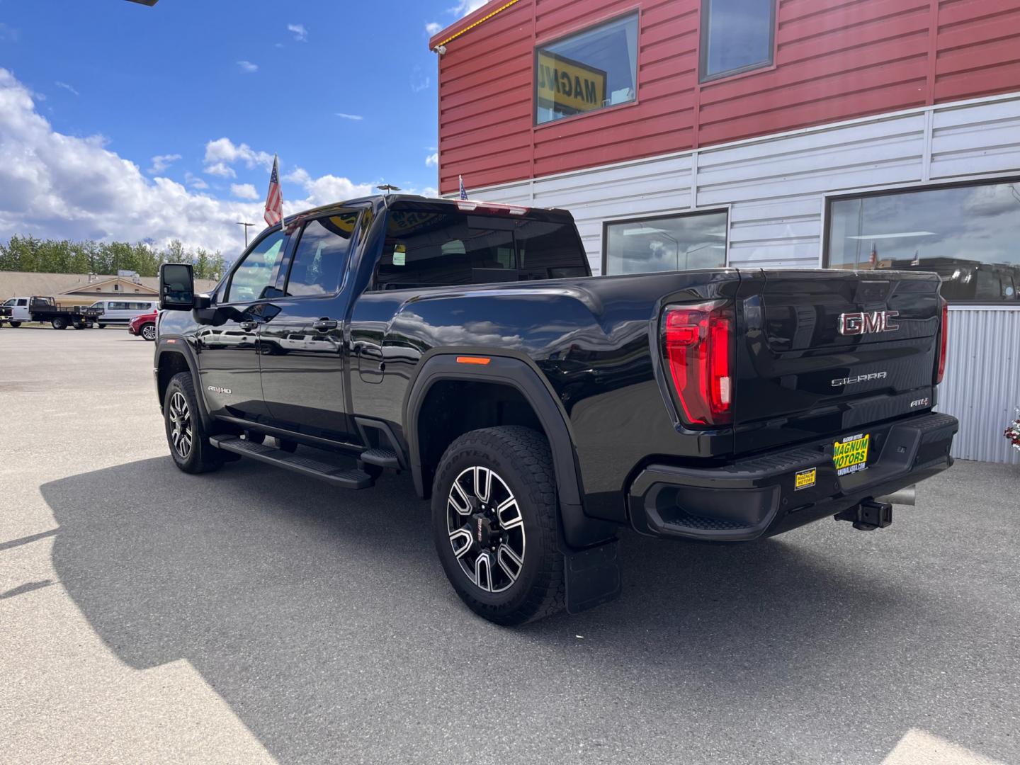 2022 Black GMC Sierra 3500HD AT4 Crew Cab Long Box 4WD (1GT49VEY3NF) with an 6.6L V8 OHV 16 DIESEL engine, 6A transmission, located at 1960 Industrial Drive, Wasilla, 99654, (907) 274-2277, 61.573475, -149.400146 - Photo#2