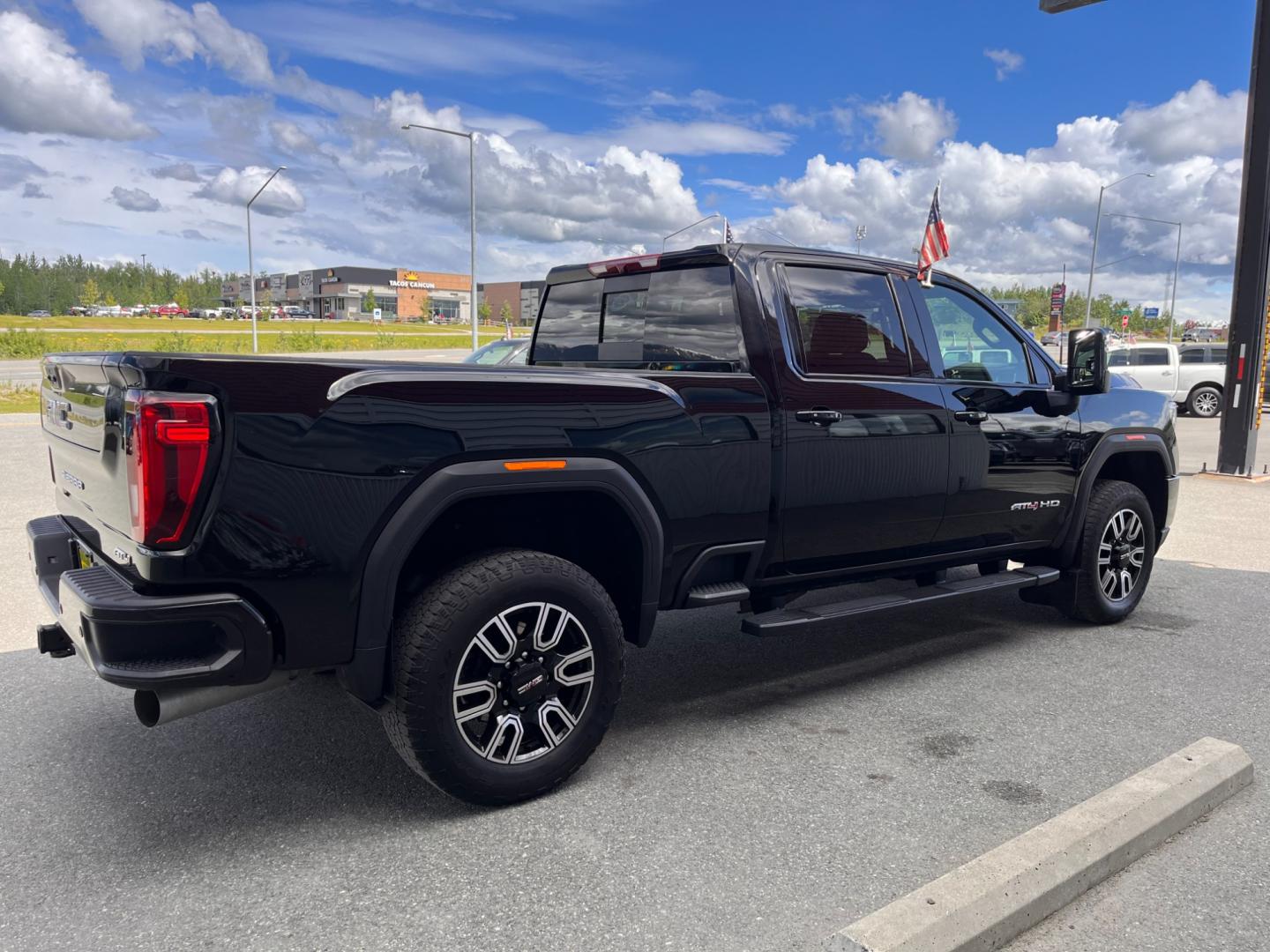 2022 Black GMC Sierra 3500HD AT4 Crew Cab Long Box 4WD (1GT49VEY3NF) with an 6.6L V8 OHV 16 DIESEL engine, 6A transmission, located at 1960 Industrial Drive, Wasilla, 99654, (907) 274-2277, 61.573475, -149.400146 - Photo#4