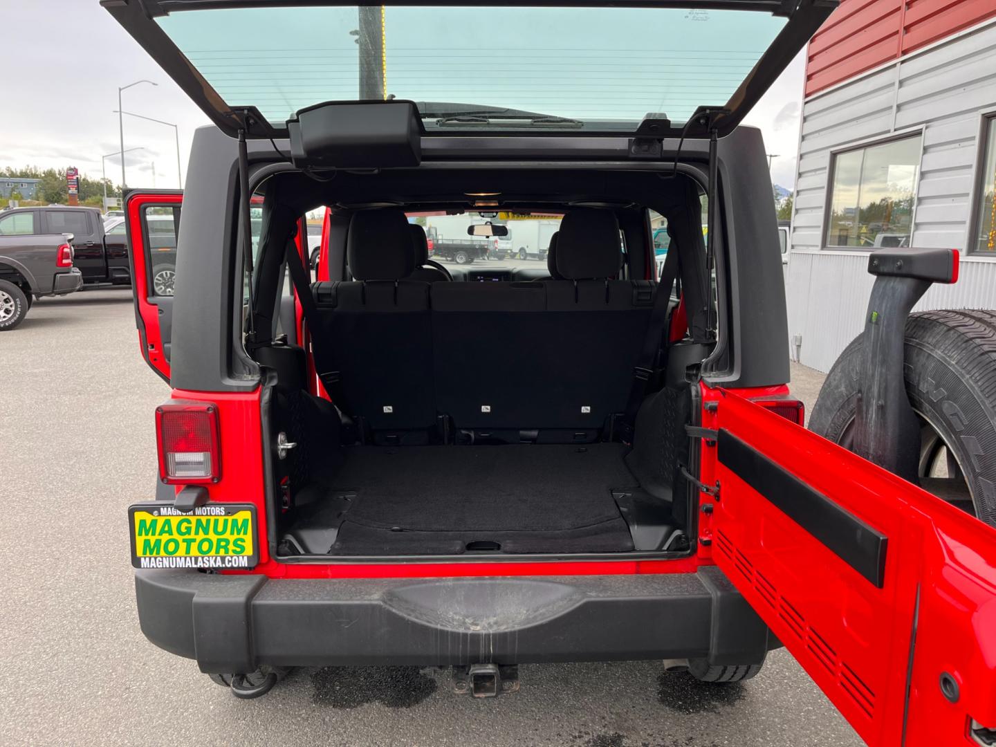 2018 RED JEEP WRANGLER JK UNL SPORT (1C4BJWDG2JL) with an 3.6L engine, 6-Speed Manual transmission, located at 1960 Industrial Drive, Wasilla, 99654, (907) 274-2277, 61.573475, -149.400146 - Photo#11