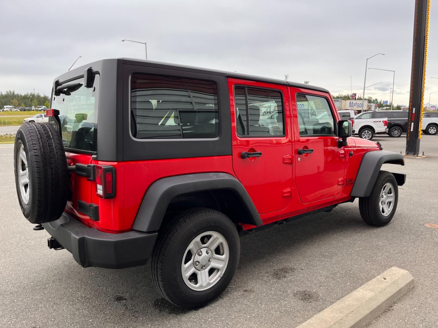 2018 RED JEEP WRANGLER JK UNL SPORT (1C4BJWDG2JL) with an 3.6L engine, 6-Speed Manual transmission, located at 1960 Industrial Drive, Wasilla, 99654, (907) 274-2277, 61.573475, -149.400146 - Photo#4