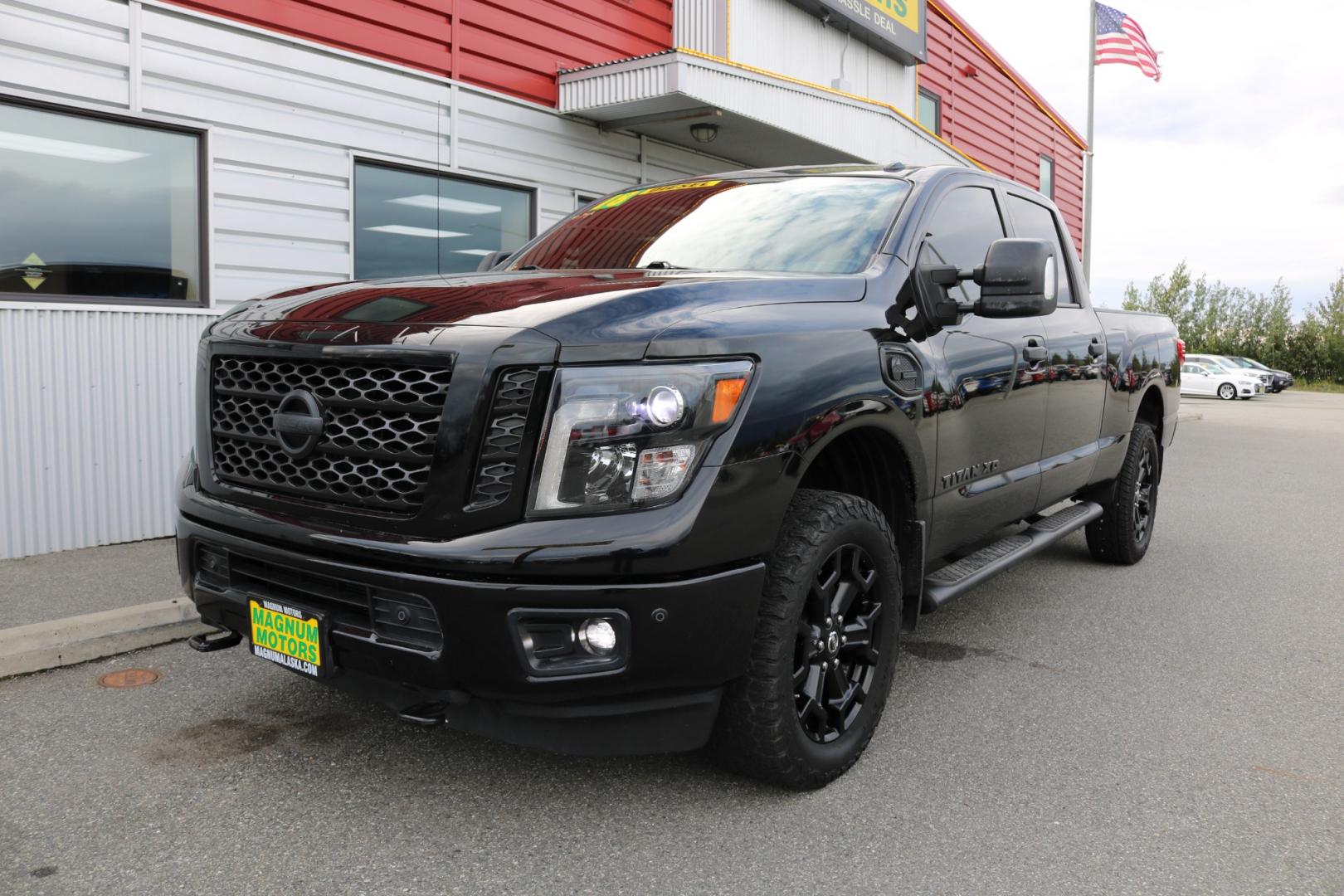 2018 BLACK /Black leather NISSAN TITAN XD SL (1N6BA1F41JN) with an 5.0L engine, Automatic transmission, located at 1960 Industrial Drive, Wasilla, 99654, (907) 274-2277, 61.573475, -149.400146 - Photo#0