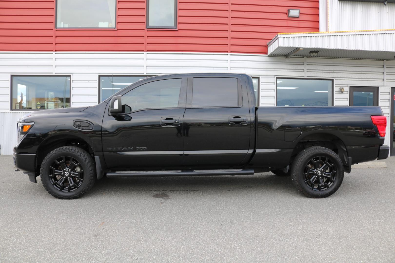 2018 BLACK /Black leather NISSAN TITAN XD SL (1N6BA1F41JN) with an 5.0L engine, Automatic transmission, located at 1960 Industrial Drive, Wasilla, 99654, (907) 274-2277, 61.573475, -149.400146 - Photo#1