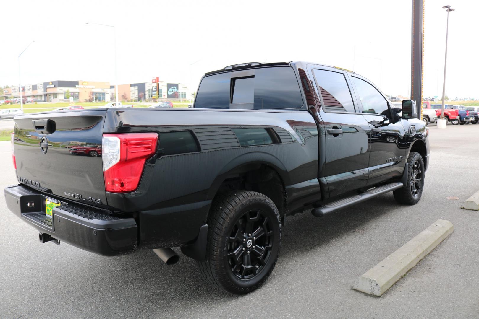 2018 BLACK /Black leather NISSAN TITAN XD SL (1N6BA1F41JN) with an 5.0L engine, Automatic transmission, located at 1960 Industrial Drive, Wasilla, 99654, (907) 274-2277, 61.573475, -149.400146 - Photo#4