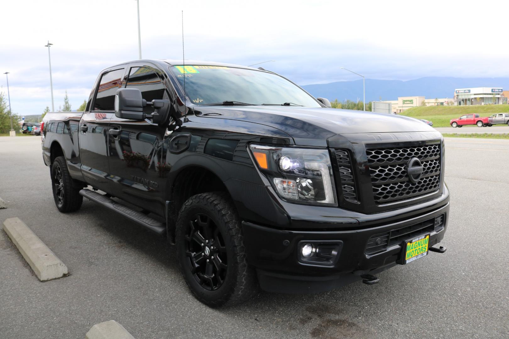 2018 BLACK /Black leather NISSAN TITAN XD SL (1N6BA1F41JN) with an 5.0L engine, Automatic transmission, located at 1960 Industrial Drive, Wasilla, 99654, (907) 274-2277, 61.573475, -149.400146 - Photo#5