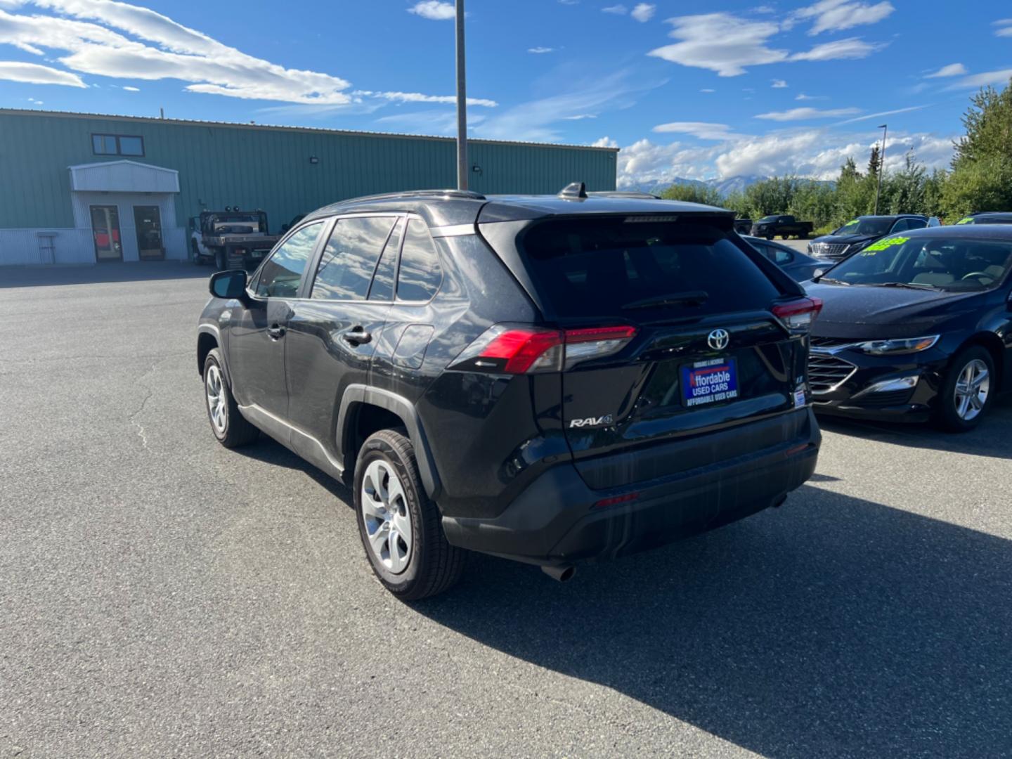 2021 BLACK TOYOTA RAV4 LE (2T3F1RFV7MW) with an 2.5L engine, Automatic transmission, located at 1960 Industrial Drive, Wasilla, 99654, (907) 274-2277, 61.573475, -149.400146 - Photo#4