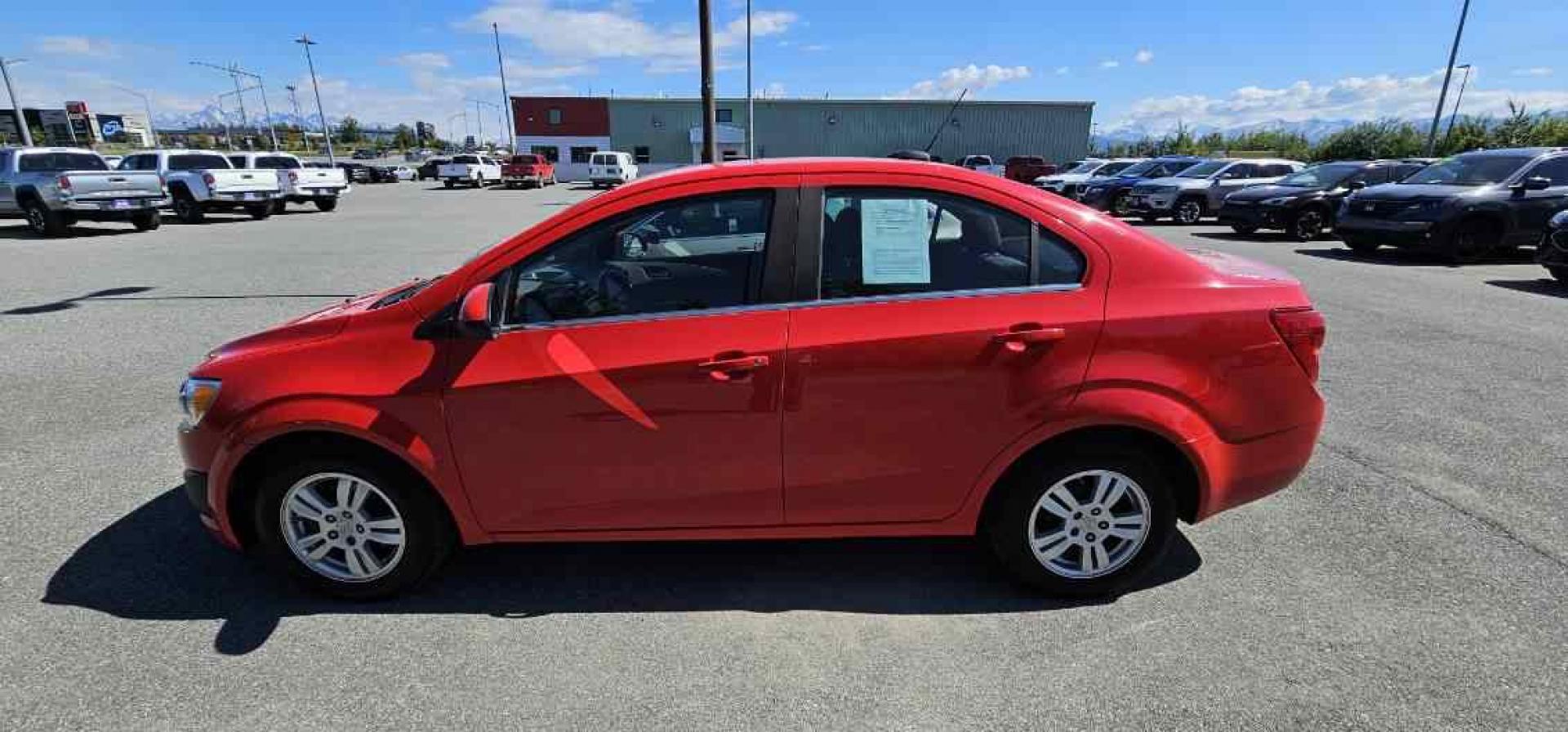 2016 RED CHEVROLET SONIC LT (1G1JC5SH7G4) with an 1.8L engine, Automatic transmission, located at 1960 Industrial Drive, Wasilla, 99654, (907) 274-2277, 61.573475, -149.400146 - Photo#1