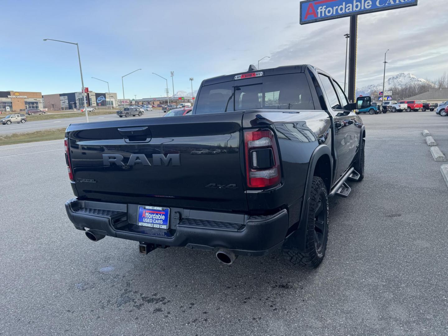 2021 BLACK RAM 1500 Rebel Crew Cab 4WD (1C6SRFLT6MN) with an 5.7L V8 OHV 16V engine, 8A transmission, located at 1960 Industrial Drive, Wasilla, 99654, (907) 274-2277, 61.573475, -149.400146 - Photo#3