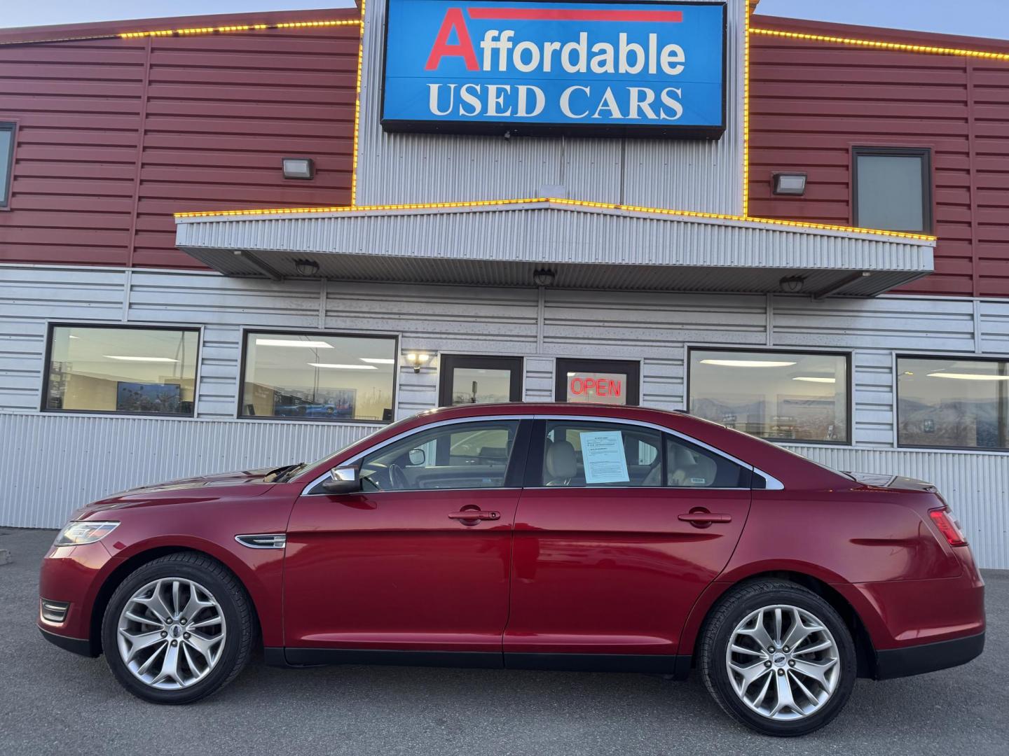 2017 RED FORD TAURUS LIMITED (1FAHP2F80HG) with an 3.5L engine, Automatic transmission, located at 1960 Industrial Drive, Wasilla, 99654, (907) 274-2277, 61.573475, -149.400146 - Photo#1