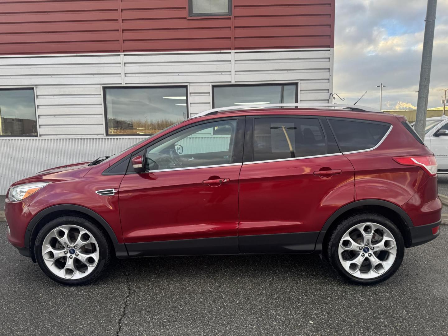 2015 RED Ford Escape Titanium 4WD (1FMCU9JX2FU) with an 1.6L L4 DOHC 16V engine, 6-Speed Automatic transmission, located at 1960 Industrial Drive, Wasilla, 99654, (907) 274-2277, 61.573475, -149.400146 - Photo#1