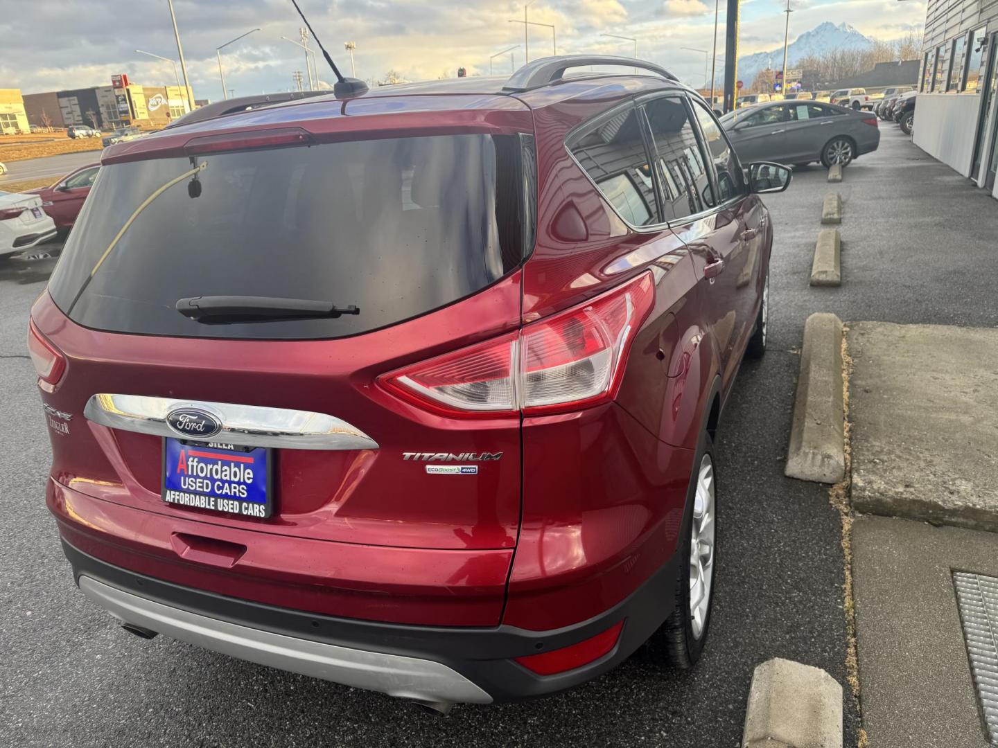 2015 RED Ford Escape Titanium 4WD (1FMCU9JX2FU) with an 1.6L L4 DOHC 16V engine, 6-Speed Automatic transmission, located at 1960 Industrial Drive, Wasilla, 99654, (907) 274-2277, 61.573475, -149.400146 - Photo#3