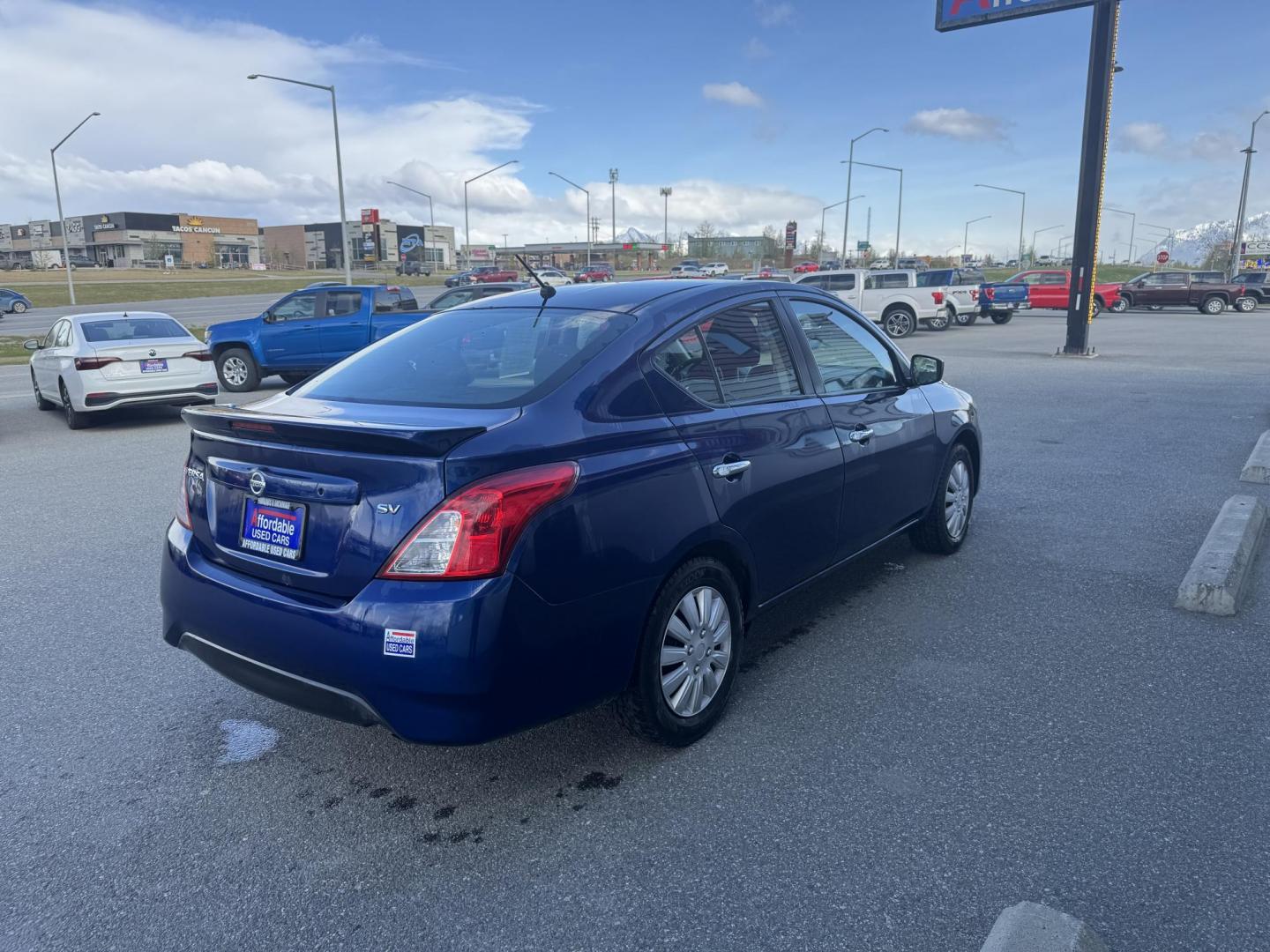 2019 BLUE Nissan Versa 1.6 SV Sedan (3N1CN7AP3KL) with an 1.6L L4 DOHC 16V engine, CVT transmission, located at 1960 Industrial Drive, Wasilla, 99654, (907) 274-2277, 61.573475, -149.400146 - Photo#4