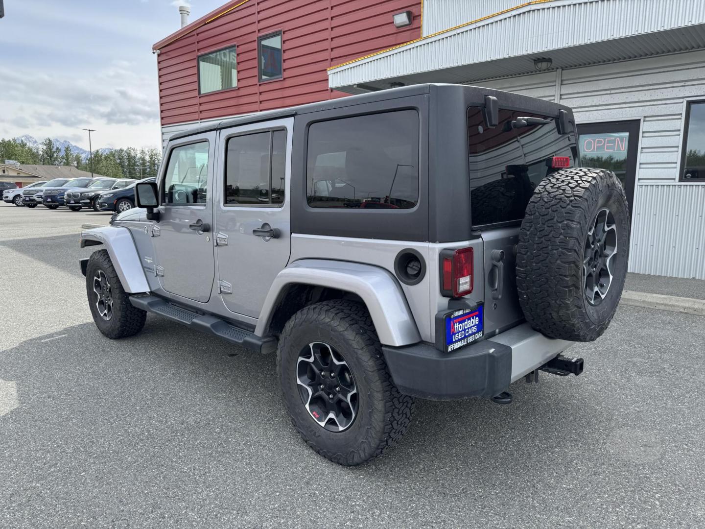 2013 SILVER Jeep Wrangler Unlimited Sahara 4WD (1C4HJWEG5DL) with an 3.6L V6 DOHC 24V FFV engine, Automatic transmission, located at 1960 Industrial Drive, Wasilla, 99654, (907) 274-2277, 61.573475, -149.400146 - Photo#1