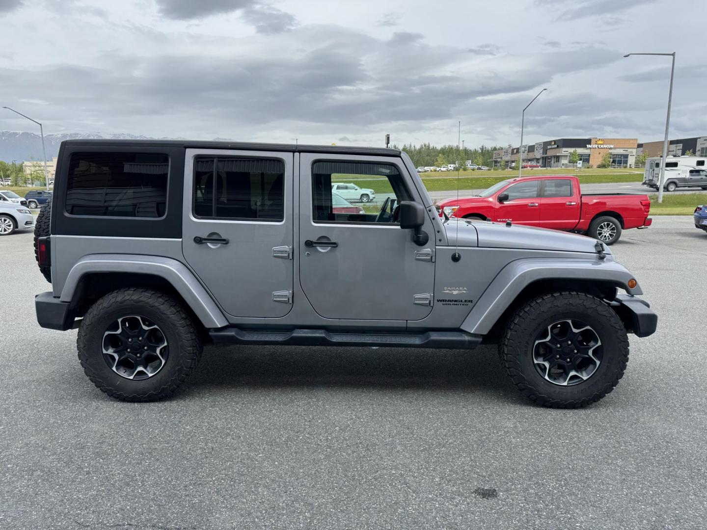 2013 SILVER Jeep Wrangler Unlimited Sahara 4WD (1C4HJWEG5DL) with an 3.6L V6 DOHC 24V FFV engine, Automatic transmission, located at 1960 Industrial Drive, Wasilla, 99654, (907) 274-2277, 61.573475, -149.400146 - Photo#4