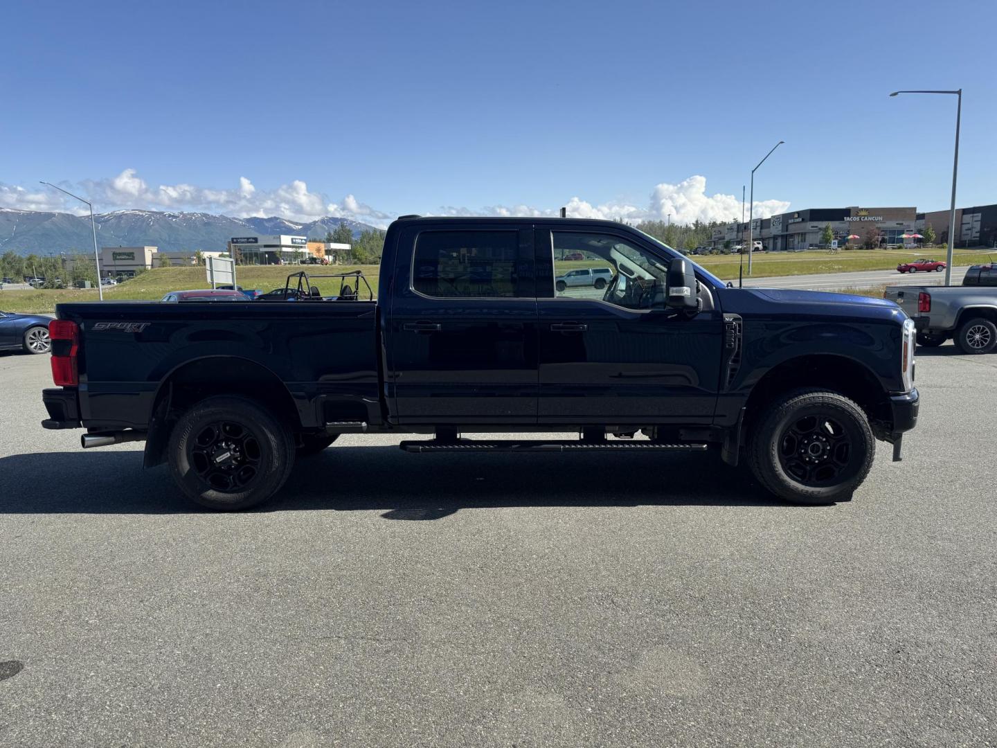 2024 BLUE Ford F-250 SD XLT Crew Cab 4WD (1FT8W2BN0RE) with an 7.3L V8 OHV 16V engine, 6A transmission, located at 1960 Industrial Drive, Wasilla, 99654, (907) 274-2277, 61.573475, -149.400146 - Photo#4