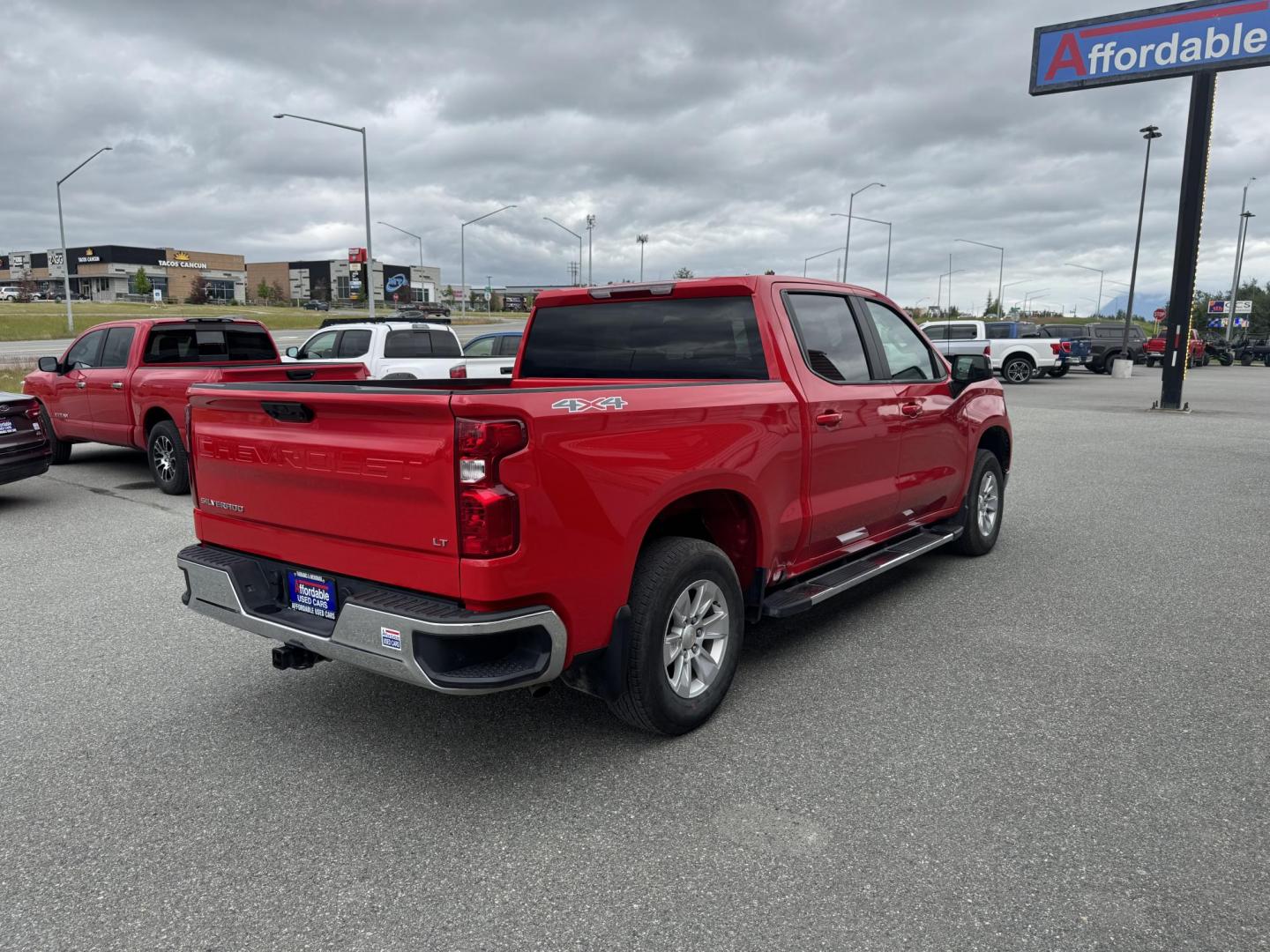 2023 RED Chevrolet Silverado 1500 LT Crew Cab 4WD (1GCUDDED4PZ) with an 5.3L V8 OHV 16V engine, 6A transmission, located at 1960 Industrial Drive, Wasilla, 99654, (907) 274-2277, 61.573475, -149.400146 - Photo#3