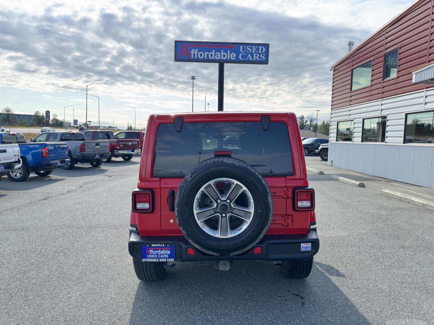 2018 RED Jeep Wrangler JK Unlimited Sahara (1C4HJXEG6JW) with an 3.6L V6 DOHC 24V FFV engine, 6A transmission, located at 1960 Industrial Drive, Wasilla, 99654, (907) 274-2277, 61.573475, -149.400146 - Photo#2