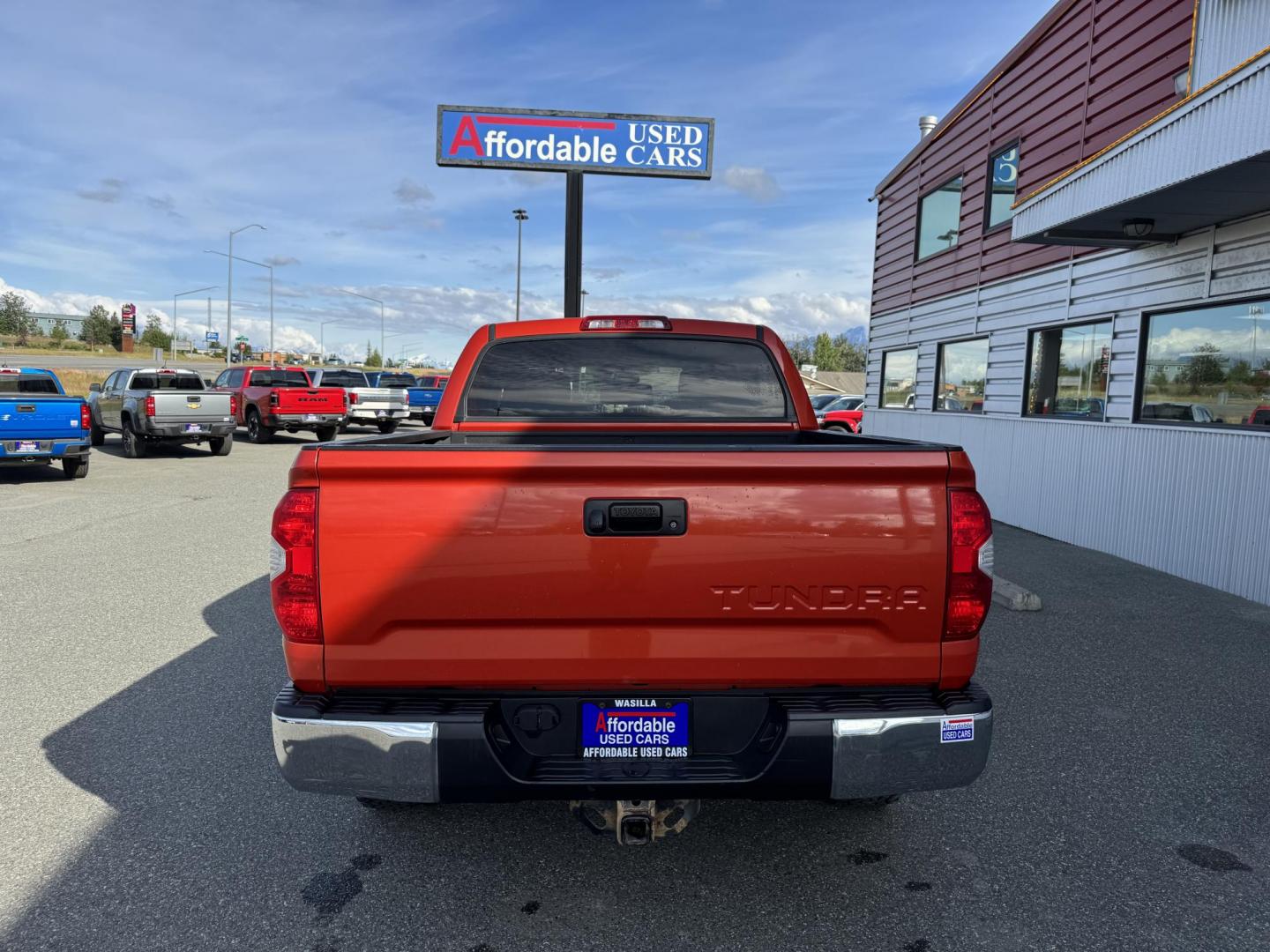 2017 Orange Toyota Tundra SR5 5.7L V8 CrewMax TRD Off Road 4WD (5TFDY5F19HX) with an 5.7L V8 DOHC 32V engine, 6A transmission, located at 1960 Industrial Drive, Wasilla, 99654, (907) 274-2277, 61.573475, -149.400146 - Photo#2