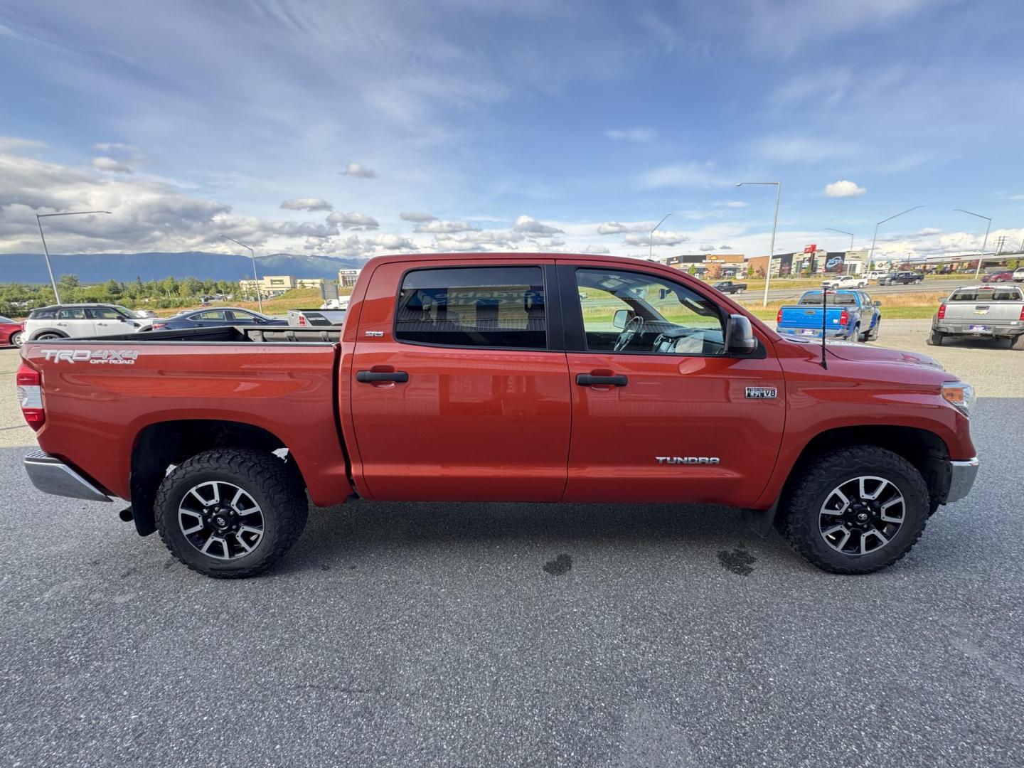 2017 Orange Toyota Tundra SR5 5.7L V8 CrewMax TRD Off Road 4WD (5TFDY5F19HX) with an 5.7L V8 DOHC 32V engine, 6A transmission, located at 1960 Industrial Drive, Wasilla, 99654, (907) 274-2277, 61.573475, -149.400146 - Photo#4